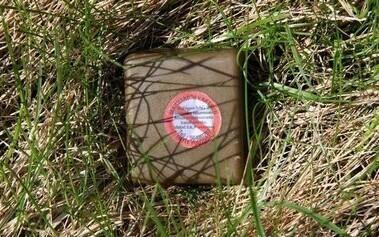 Vaccine bait marked with a warning sticker.