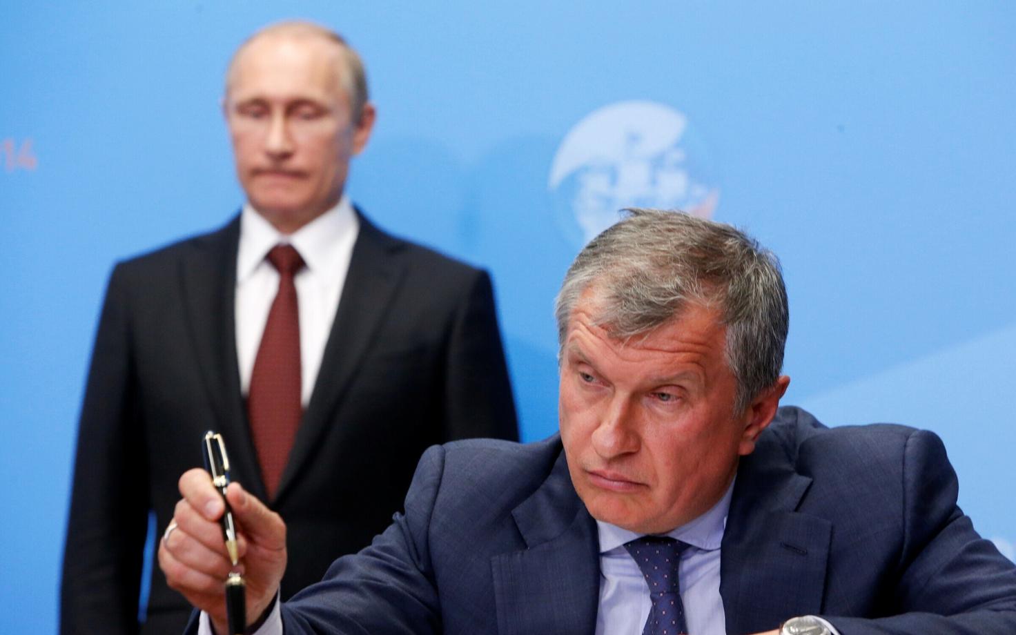 Rosnefti juht Igor Setšin, taustal Venemaa president Vladimir Putin.