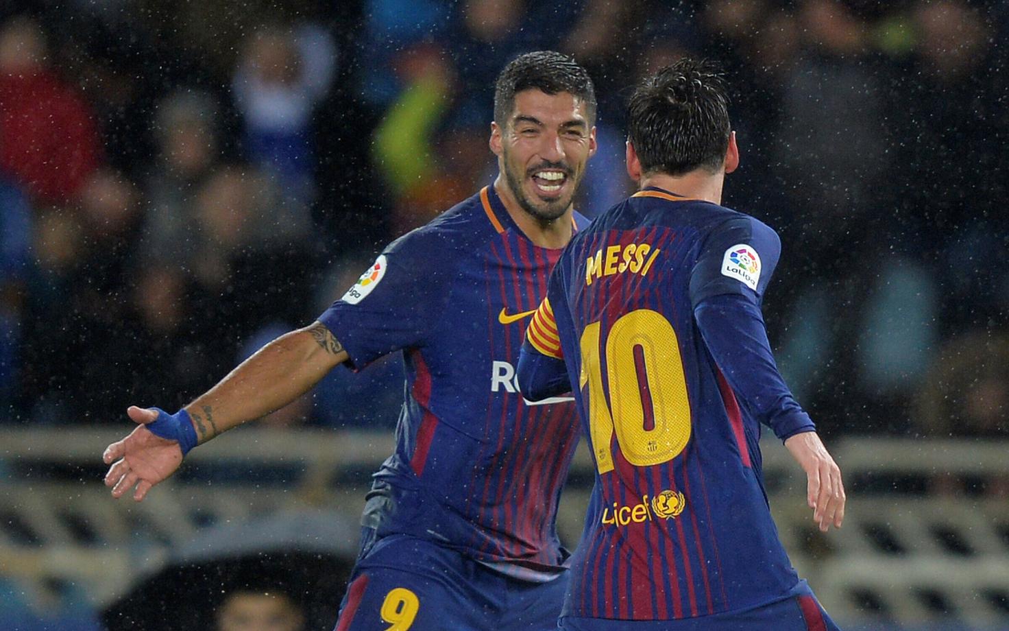 Luis Suarez ja Lionel Messi