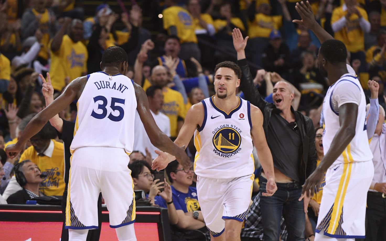 Kevin Durant, Klay Thompson ja Draymond Green.