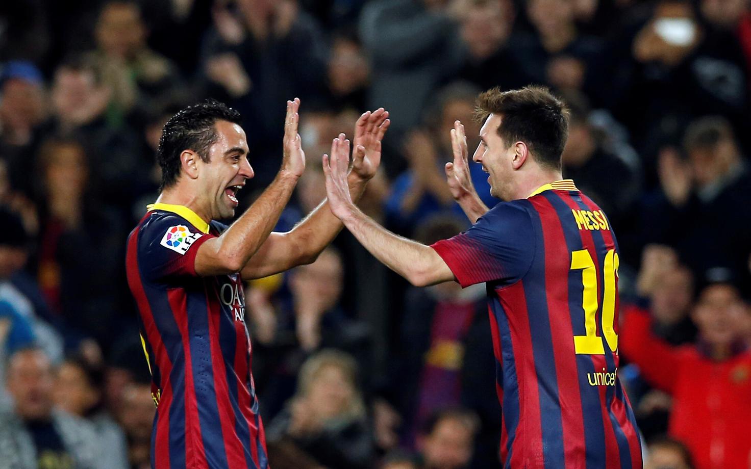 Xavi (vasakul) ja Lionel Messi