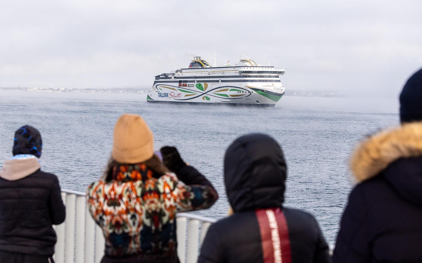 Tallink's MS MyStar arriving in Tallinn as onlookers watch.