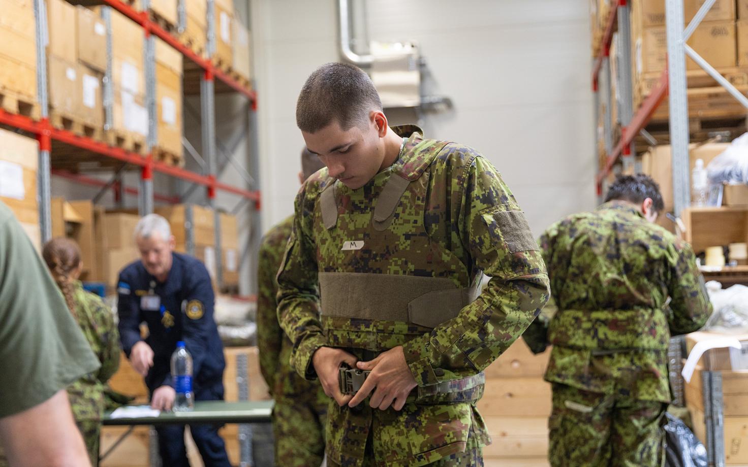 New conscripts receiving their gear.