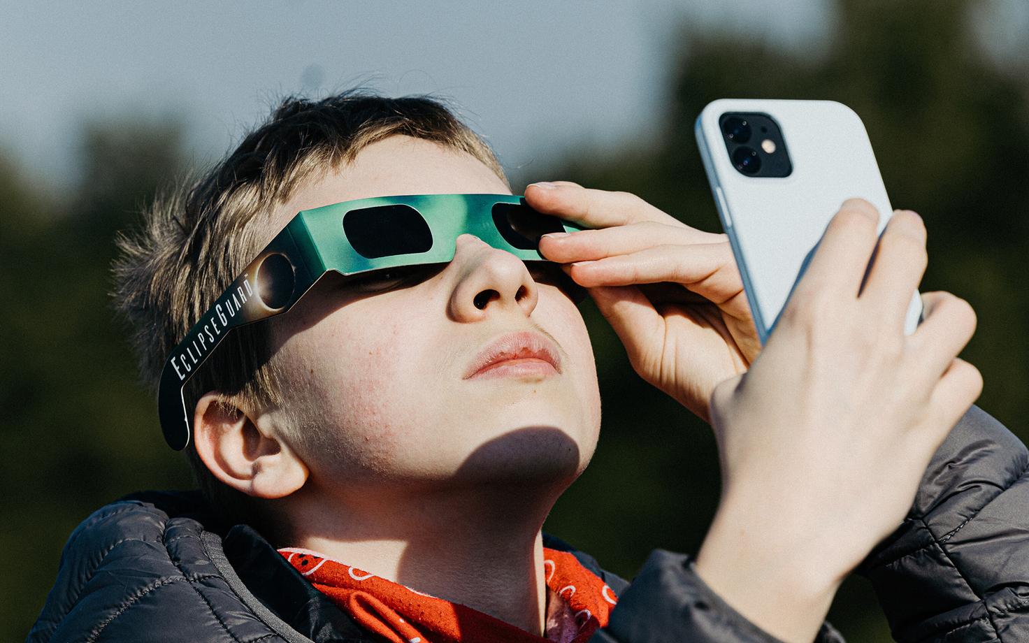 A partial solar eclipse being viewed through eclipse glasses from the roof of Tallinn's Nõmme Hobby School. March 29, 2025.